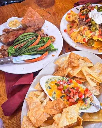 Red's Old 395 Grill signature dishes Macho Nachos
Flame Grilled Ribeye
Cajun Chicken Pasta